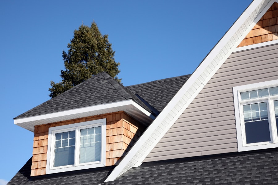 Small Dormer loft Conversion withtile cladding and gret roof tiles