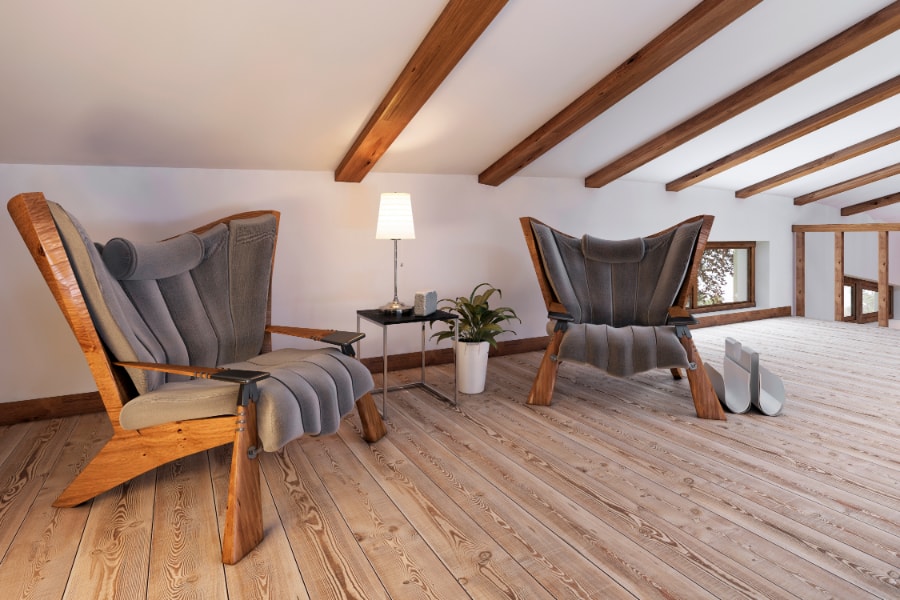 Loft conversion with wooden floor boards 2 seater and chair with oak wooden ceiling beams