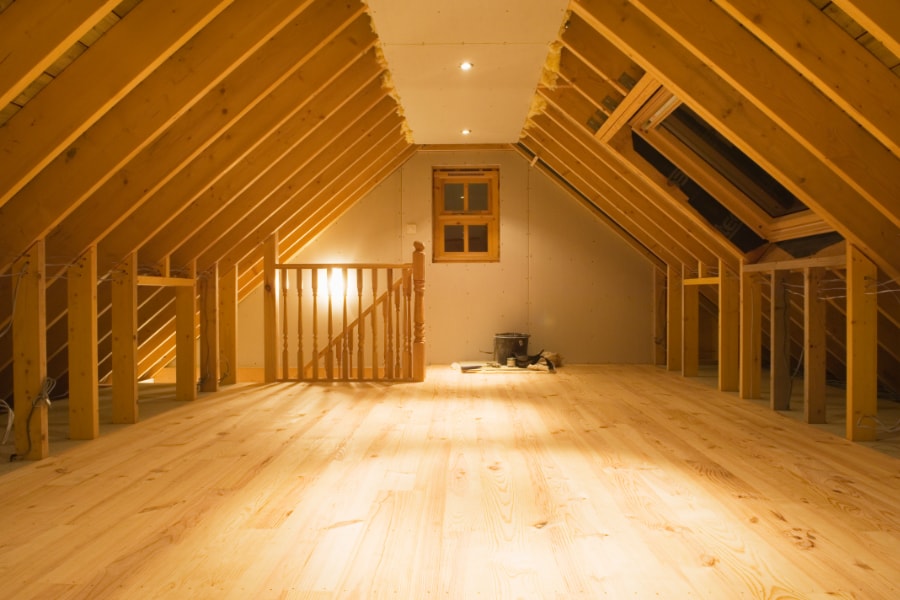 Hip to Gable Loft conversion showing roof trusses, stairs, velux roof lights and large oak wooden floor boards